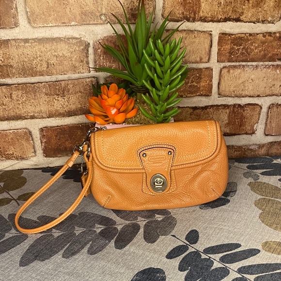 Coach Handbags - Coach Orange legacy turnlock Wristlet